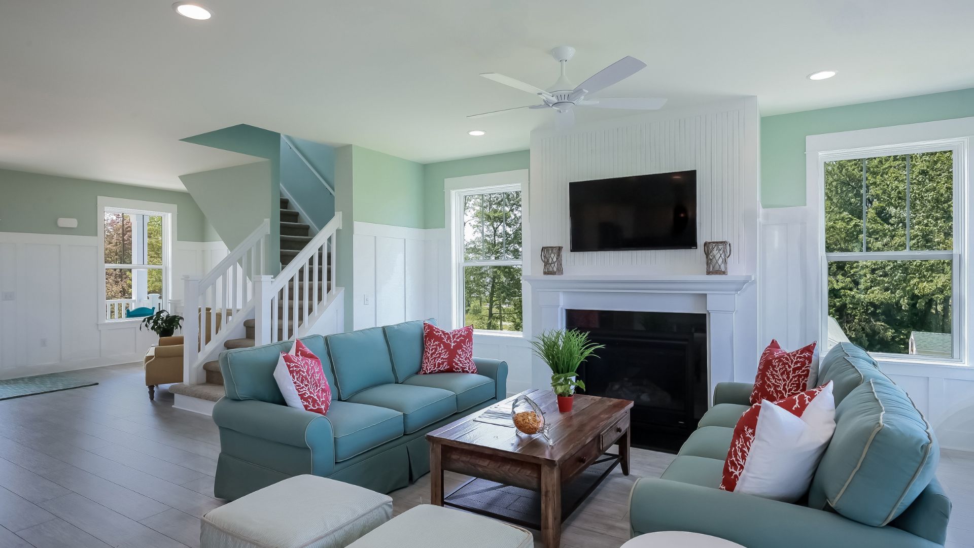 A living room filled with furniture and a flat screen tv